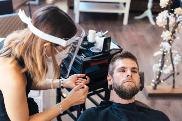 Top view of a man lying on a hairdresser chair