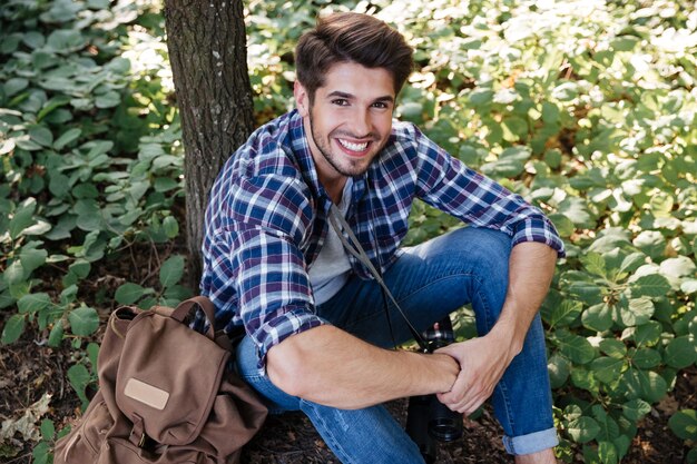 Top view of man sitting in forest