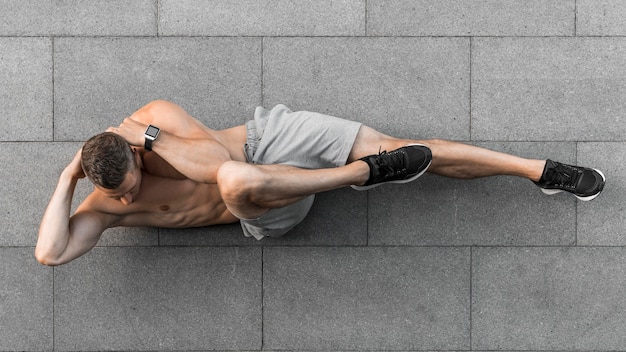 Photo top view man working out outdoors