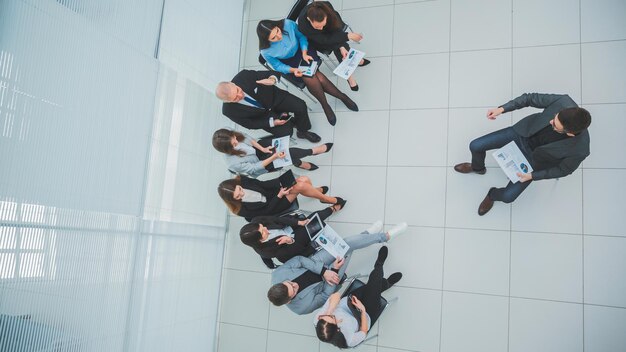 Top view. the Manager holds a meeting with the business team.