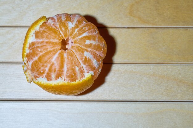 Top view of mandarin on wooden background