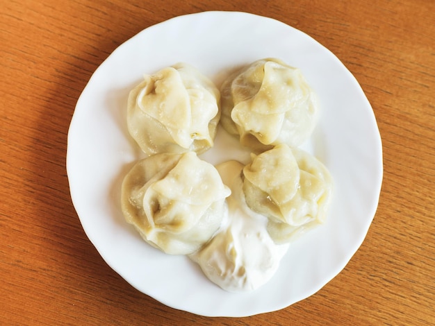 Top view of manti dumpling on white plate