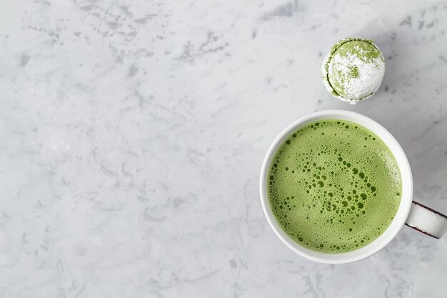 Top view of matcha tea and mochis