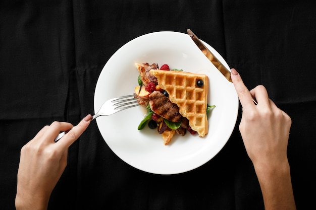 Top view of meat dish with grilled fruits berries