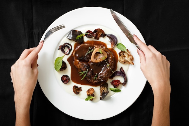 Top view of meat dish with grilled vegetables