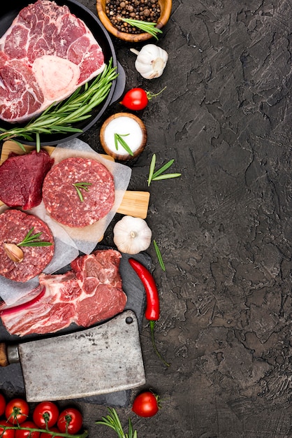 Top view of meat with tomatoes and chili