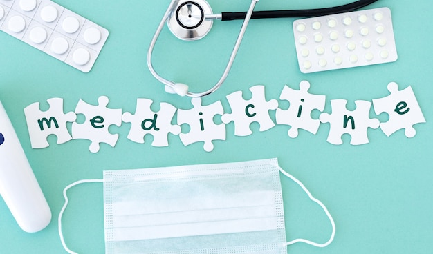 Top view of medical equipment and blank puzzle pieces