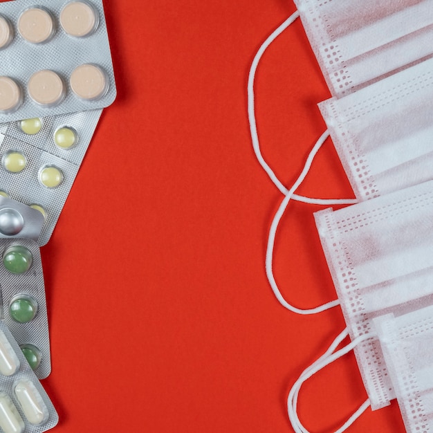 Top view of medical protective masks and pills