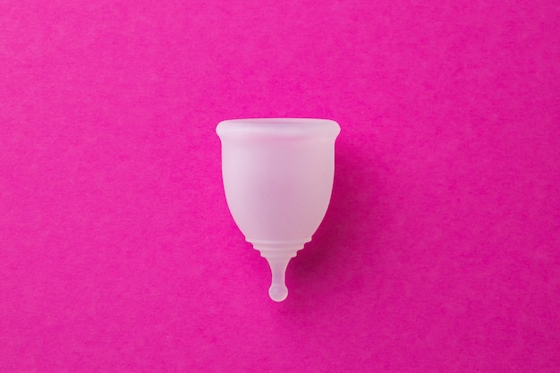 Photo top view of menstrual cup on paper