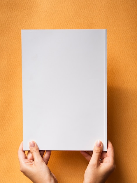 Top view mock-up magazine with orange background