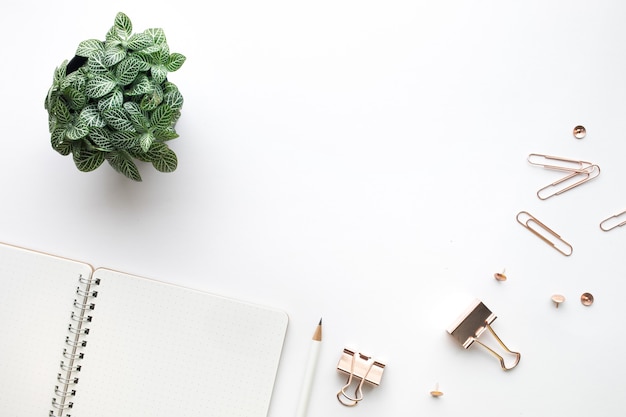 Top view of Mockup notepad and accessories in white