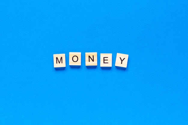 Top view money written with wooden letters