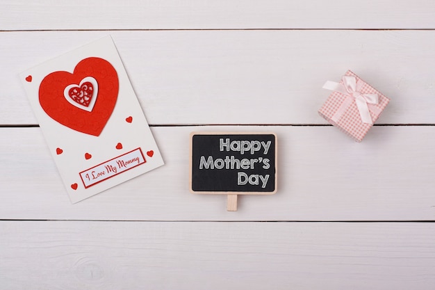 Top view mothers day concept with greeting card