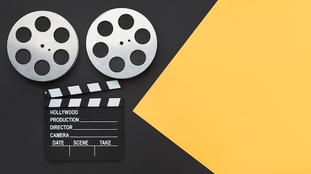 Top view movie making elements on bicolor background with copy space