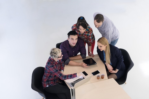 top view of multi ethnic startup business people group on brainstorming meeting in modern bright office interior