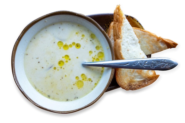 Top view of Mushroom soup bowl finished with truffle oil and toasted bread focus selective