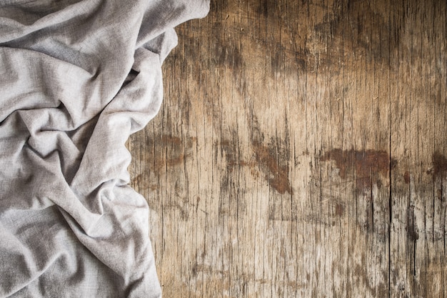 Top view of napkin on empty old wooden background