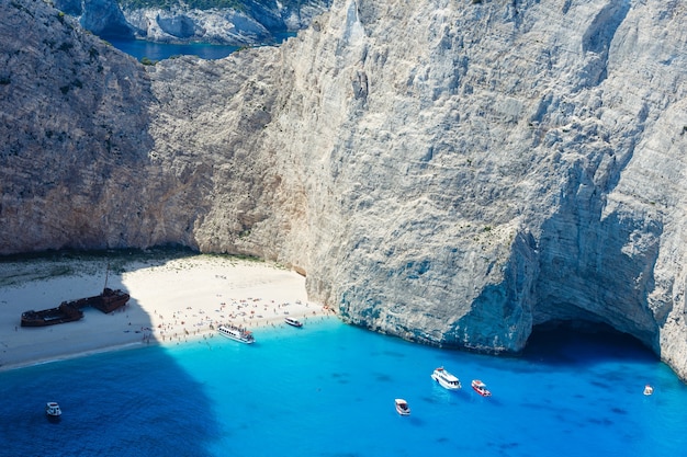 Top view on Navagio bay. Summer coastline view (Greece, Zakynthos, Ionian Sea). All peoples unrecognizable.