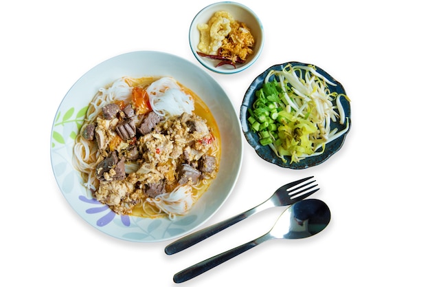 Top view of Northern Thai food rice noodles with spicy soup with vegetables