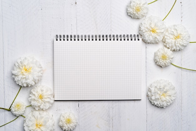 top view Notebook and flowers