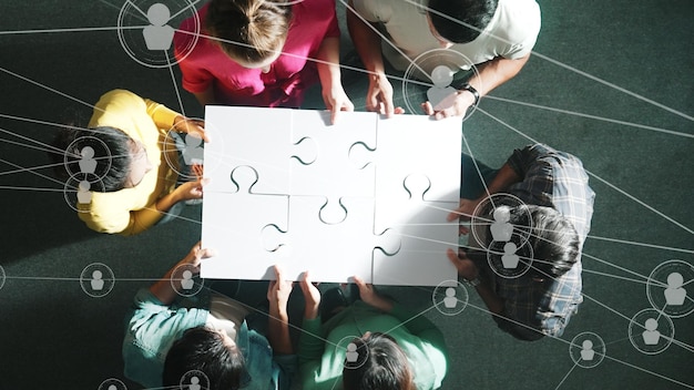 写真 top view of business people gathering jigsaw together at meeting symposium