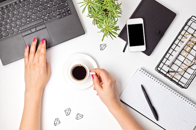 Top view of office desk. Table with laptop and office supplies. Flat lay home office workspace, remote work, distant learning, video conference, calls concept