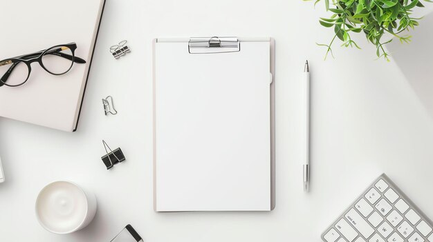 Top view office desk with blank clipboard pen glasses paper clips candle plant keyboard and notebook workspace and feminine desk concept