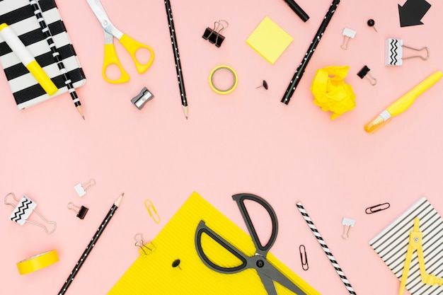 Top view of office stationery with scissors and pencils