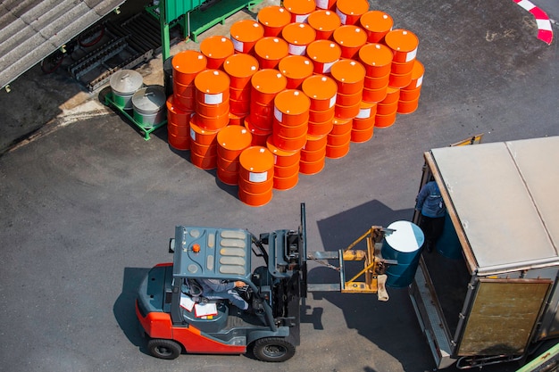 Top view oil barrels forklift truck move for on the transportation truck