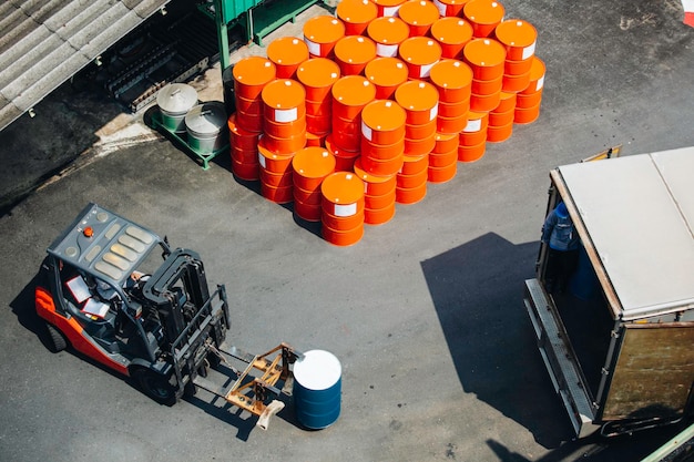 Top view oil barrels forklift truck move for on the transportation