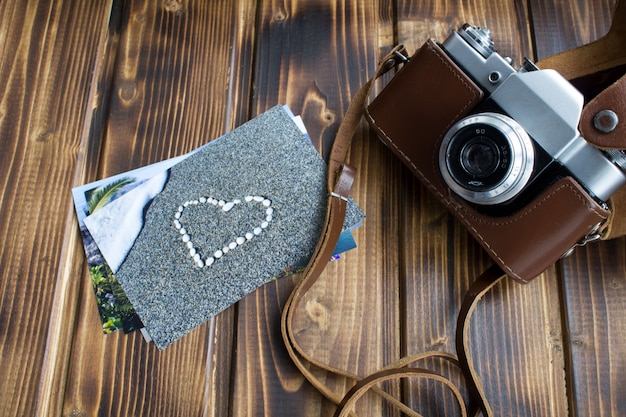 Top view of old camera and pictures