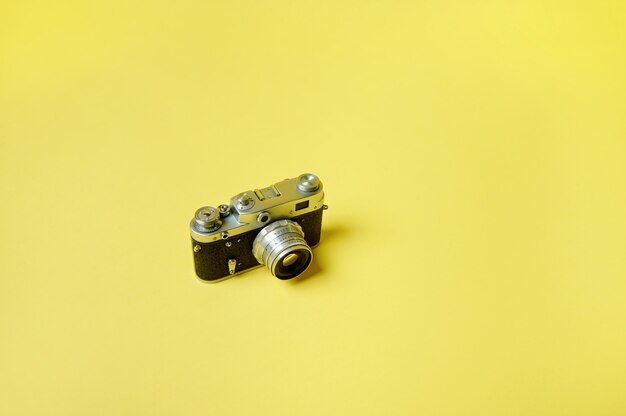 Photo top view of an old model manual film camera isolated. flat lay.