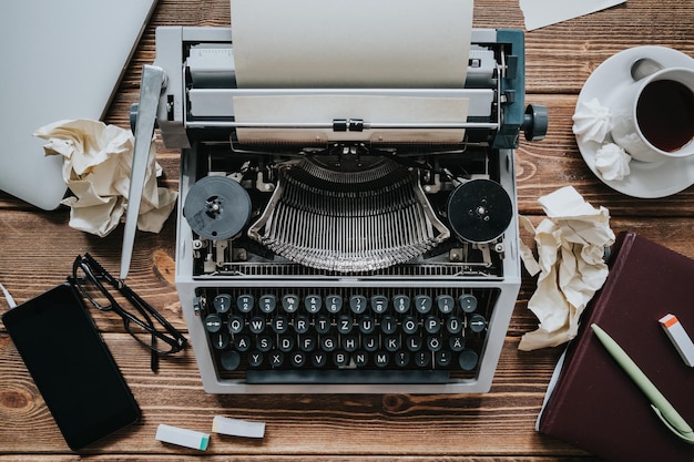 Top view of an old typewriter on a wooden table