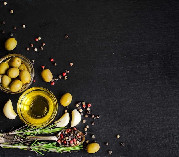 Top view of olive oil and ingredients for a healthy vegetarian salad