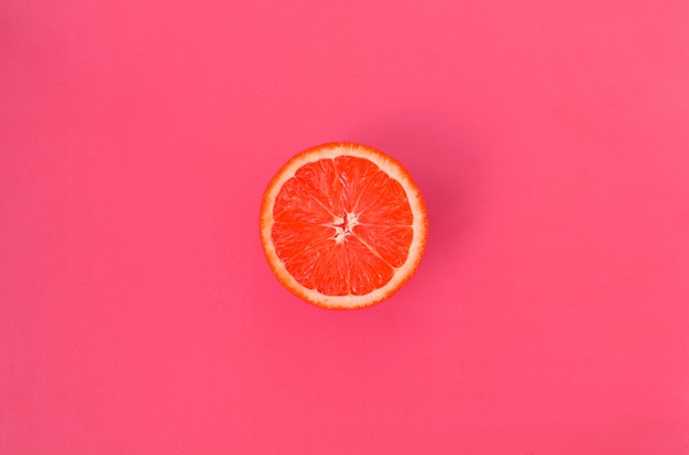 Top view of a one grapefruit slice on background 