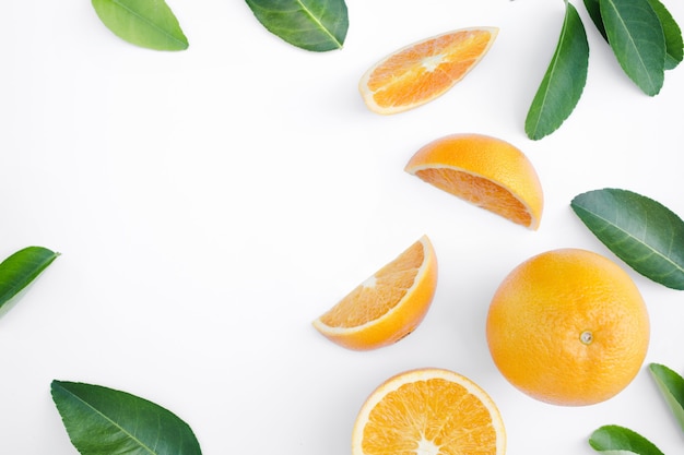 Top view of orange fruit and leaves isolated