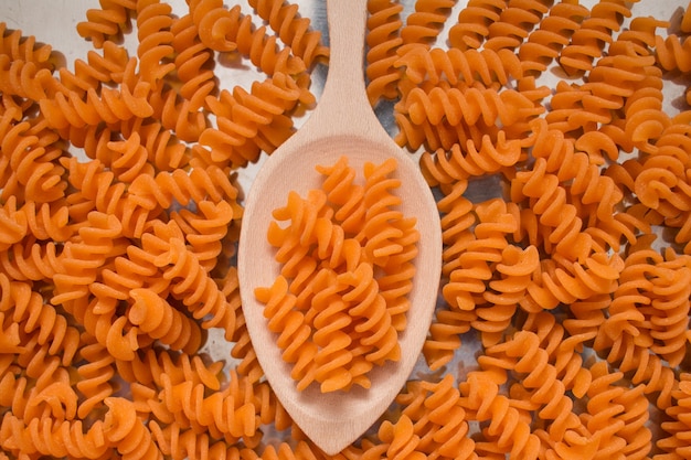 Top view organic pasta in a spoon