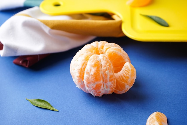 top view organic tangerines on cutting board