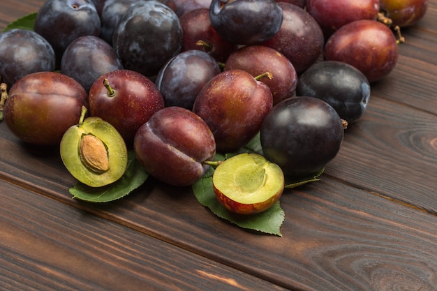 Top view orgnaic plums on table