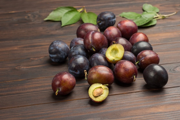 Top view orgnaic plums on table