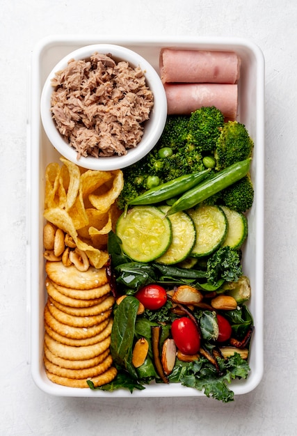 Top view packed vegetables and meat