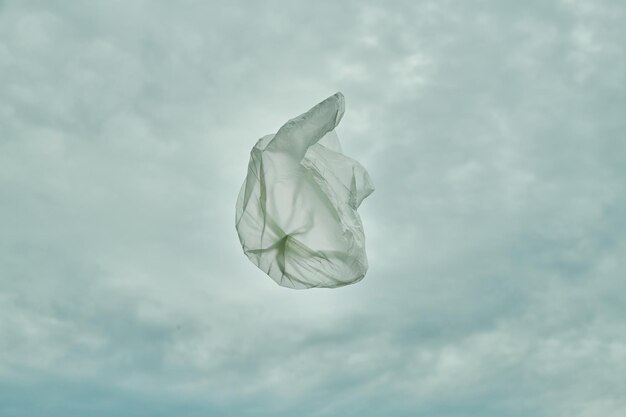 Top view of packet flying in the air against blue sky