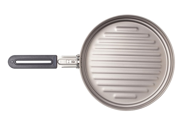 Top view of pan titanium metal cookware for mountain camping With clipping path