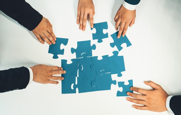 Top view panorama banner of business team assembling jigsaw puzzle Shrewd