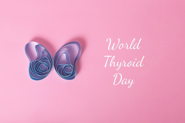 Top view of paper thyroid glandworld thyroid day concept