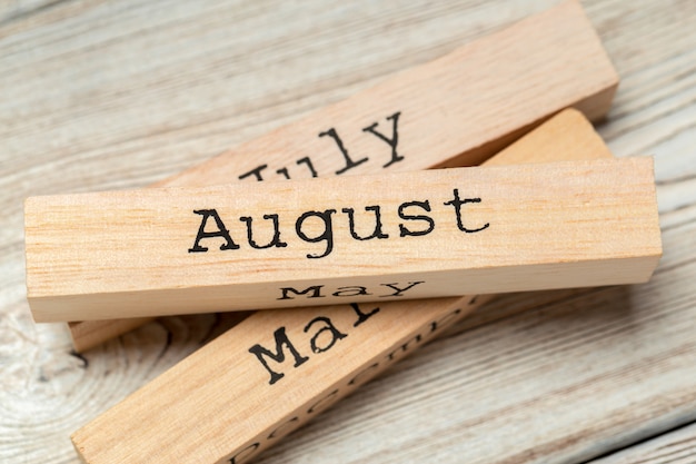 top view of parts of wooden calendar on dark wooden tabletop