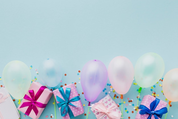 Top view party frame with balloons and gifts