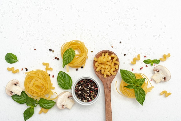 Top view of pasta and pepper on plain background