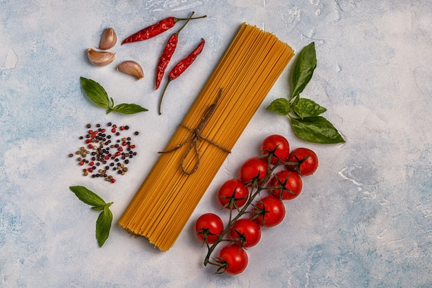 Top view of pasta, spices, and vegetables