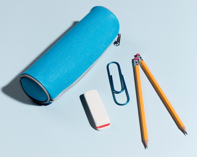 Top view pencil box with erases and paper clip
